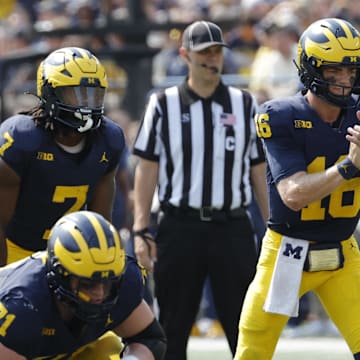 Sep 14, 2024; Ann Arbor, Michigan, USA;  Michigan Wolverines quarterback Davis Warren (16) prepares to run a play against the Arkansas State Red Wolves during the first half at Michigan Stadium.