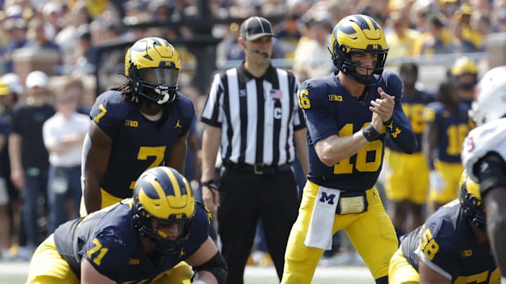 Sep 14, 2024; Ann Arbor, Michigan, USA;  Michigan Wolverines quarterback Davis Warren (16) prepares to run a play against the Arkansas State Red Wolves during the first half at Michigan Stadium.