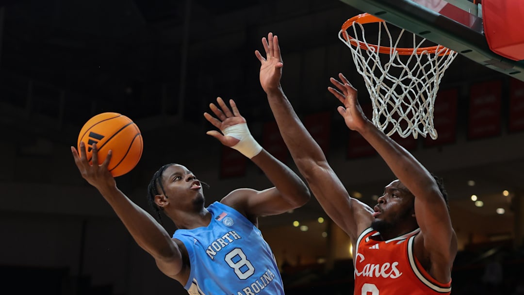 Feb 10, 2026; Coral Gables, Florida, USA; North Carolina Tar Heels forward Caleb Wilson (8) drives to the basket against Miami Hurricanes center Ernest Udeh Jr. (8) during the second half at Watsco Center. Mandatory Credit: Sam Navarro-Imagn Images Feb 10, 2026; Coral Gables, Florida, USA; North Carolina Tar Heels forward Caleb Wilson (8) drives to the basket against Miami Hurricanes center Ernest Udeh Jr. (8) during the second half at Watsco Center. Mandatory Credit: Sam Navarro-Imagn Images