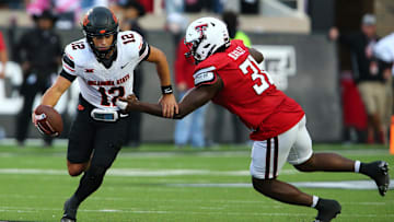 Oct 25, 2025; Lubbock, Texas, USA;  Texas Tech Red Raiders defensive end David Bailey (31) pressures Oklahoma State Cowboys quarterback Noah Walters (12) in the second half at Jones AT&T Stadium. Mandatory Credit: Michael C. Johnson-Imagn Images