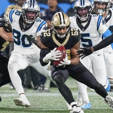 New Orleans Saints linebacker D'Marco Jackson (52) recovers an onside kick against the Carolina Panthers