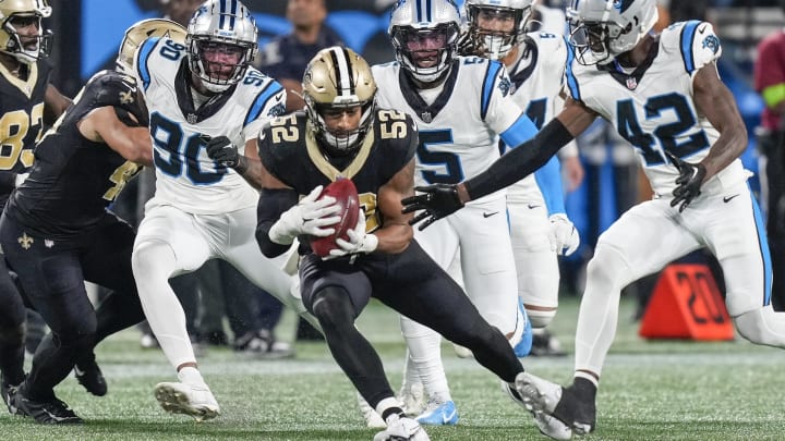 New Orleans Saints linebacker D'Marco Jackson (52) recovers an onside kick against the Carolina Panthers