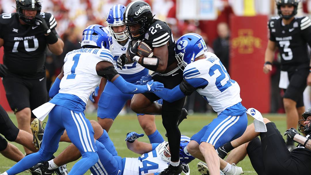 Oct 25, 2025; Ames, Iowa, USA; Iowa State Cyclones running back Abu Sama (24) is tackled by BYU Cougars cornerback Therrian Alexander (1) at Jack Trice Stadium. Mandatory Credit: Reese Strickland-Imagn Images