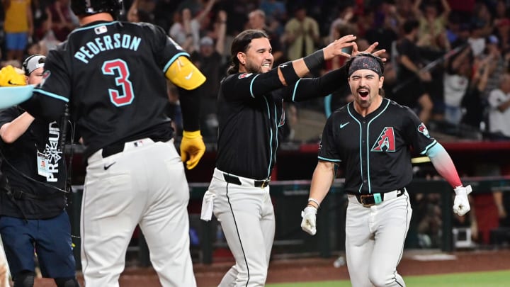 Jul 29, 2024; Phoenix, Arizona, USA;  Arizona Diamondbacks outfielder Corbin Carroll (7) celebrates with teammates after hitting a walk off home run in the ninth inning to beat the Washington Nationals at Chase Field. Mandatory Credit: Matt Kartozian-USA TODAY Sports