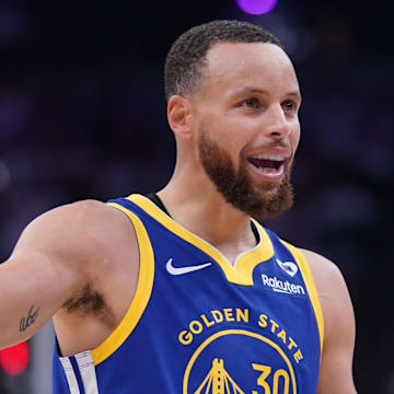 Apr 16, 2024; Sacramento, California, USA; Golden State Warriors guard Stephen Curry (30) talks with teammates after a play against the Sacramento Kings in the second quarter during a play-in game of the 2024 NBA playoffs at the Golden 1 Center. 