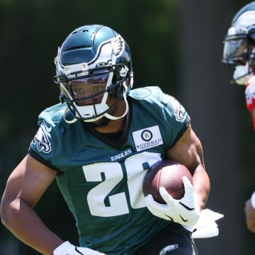 May 30, 2024; Philadelphia, PA, USA; Philadelphia Eagles running back Saquon Barkley (26) runs with the ball during practice at NovaCare Complex.