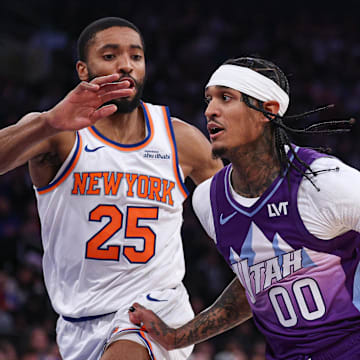 Jan 1, 2025; New York, New York, USA; Utah Jazz guard Jordan Clarkson (00) dribbles as New York Knicks forward Mikal Bridges (25) defends during the first half at Madison Square Garden. Mandatory Credit: Vincent Carchietta-Imagn Images
