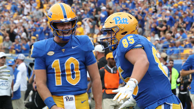 Pittsburgh Panthers quarterback Eli Holstein (10) and tight end Josh Altsman (85