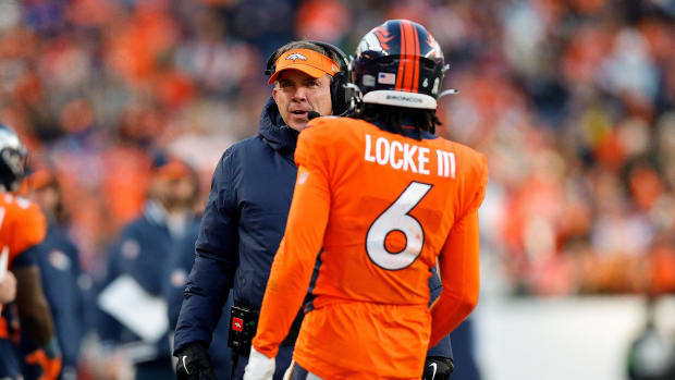 Denver Broncos head coach Sean Payton talks with safety P.J. Locke (6) in the third quarter against the Cleveland Browns.