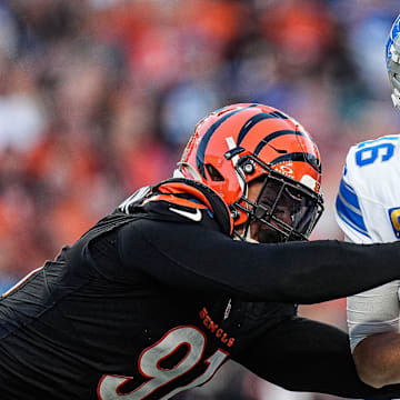 Detroit Lions quarterback Jared Goff (16) is sacked by Cincinnati Bengals defensive end Trey Hendrickson (91) during the second half at Paycor Stadium in Cincinnati on Sunday, Oct. 5, 2025.