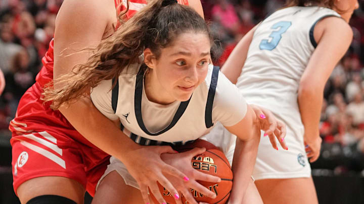 Dru Seglem of Forest City tries to strip the ball away from Addy Oetker of Des Moines Christian in the quarterfinals of the Iowa girls basketball state tournament, March 3, 2026. Dru Seglem of Forest City tries to strip the ball away from Addy Oetker of Des Moines Christian in the quarterfinals of the Iowa girls basketball state tournament, March 3, 2026.