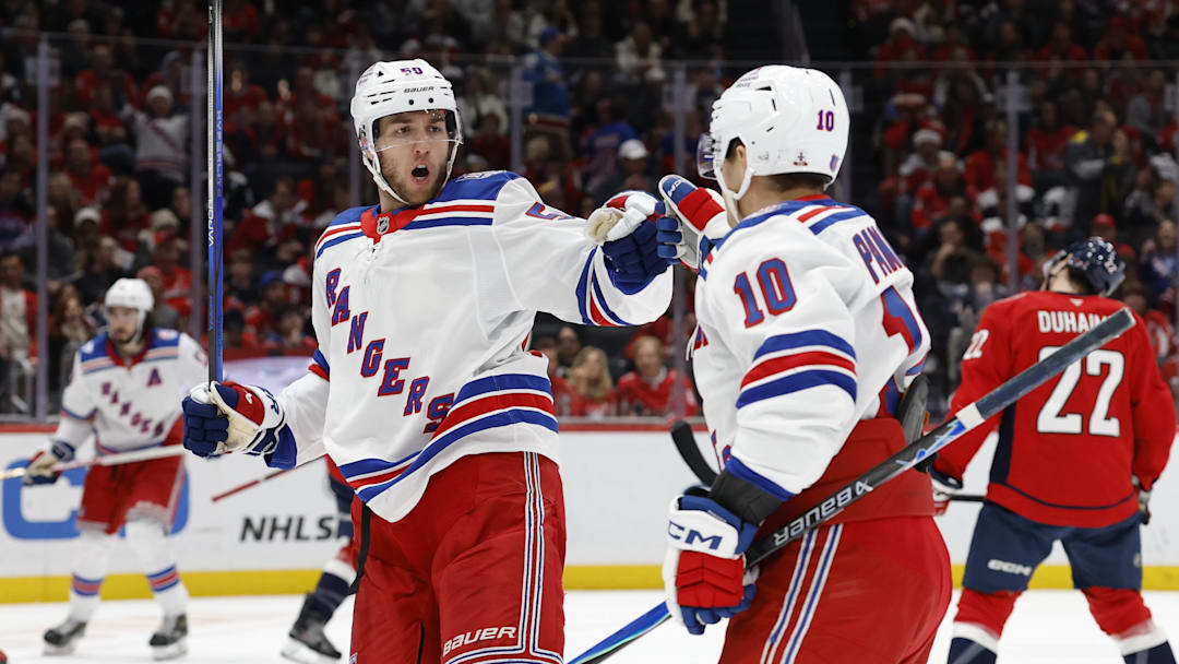 Dec 23, 2025; Washington, District of Columbia, USA; New York Rangers left wing Will Cuylle (50) celebrates with Rangers left wing Artemi Panarin (10) after scoring a goal against the Washington Capitals during the second period at Capital One Arena. Mandatory Credit: Geoff Burke-Imagn Images