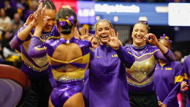 Livvy Dunne celebrates with teammates during a dual meet between the Florida Gators and the LSU Tigers.