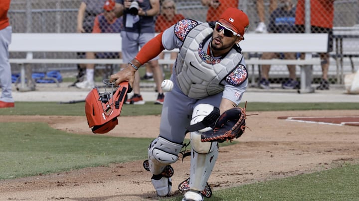 Feb 16, 2026; Jupiter, FL, USA;  St. Louis Cardinals catcher Ivan Herrera (48) fields a ball during spring training workouts at Roger Dean Stadium. Mandatory Credit: Reinhold Matay-Imagn Images