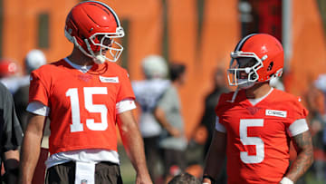Cleveland Browns quarterback Joe Flacco (15) chats with quarterback Dillon Gabriel (5) during NFL training camp practice at the Cleveland Browns training facility, Wednesday, July 23, 2025, in Berea, Ohio.
