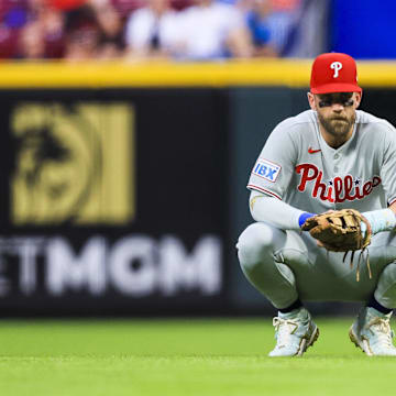 Aug 12, 2025; Cincinnati, Ohio; Philadelphia Phillies first baseman Bryce Harper (3) during a stop in play in the sixth inning against the Cincinnati Reds at Great American Ball Park. 