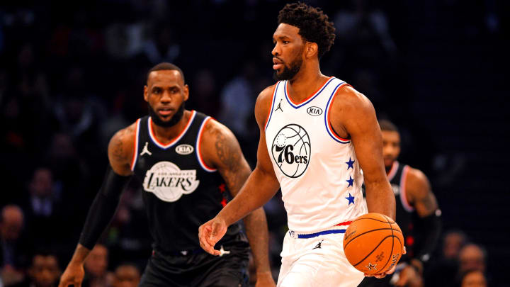 Feb 17, 2019; Charlotte, NC, USA; Team Giannis forward Joel Embiid of the Philadelphia 76ers (21) shoots the ball against Team Lebron forward Lebron James of the Los Angeles Lakers (23) during the 2019 NBA All-Star Game at Spectrum Center. Mandatory Credit: Bob Donnan-USA TODAY Sports