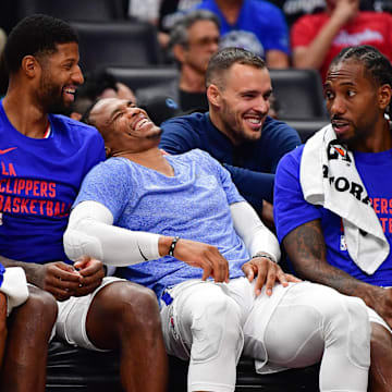 Oct 29, 2023; Los Angeles, California, USA; Los Angeles Clippers forward Nicolas Batum (33) forward Paul George (13) guard Russell Westbrook (0) and forward Kawhi Leonard (2) watch game action aganst the San Antonio Spurs during the second half at Crypto.com Arena. 