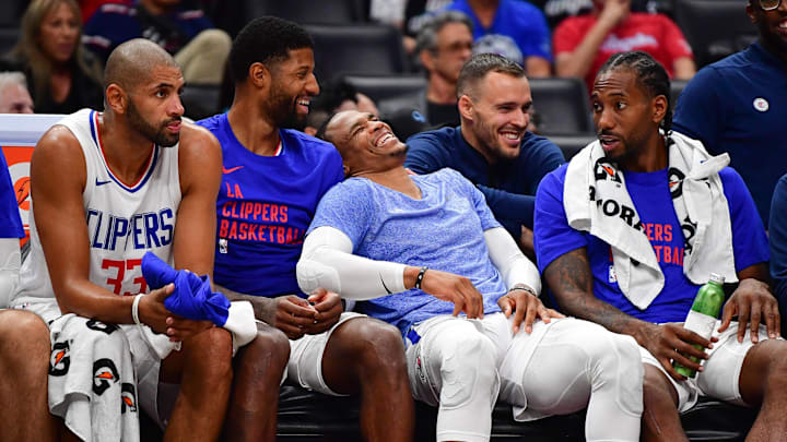 Oct 29, 2023; Los Angeles, California, USA; Los Angeles Clippers forward Nicolas Batum (33) forward Paul George (13) guard Russell Westbrook (0) and forward Kawhi Leonard (2) watch game action aganst the San Antonio Spurs during the second half at Crypto.com Arena. 