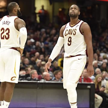 Nov 7, 2017; Cleveland, OH, USA; Cleveland Cavaliers forward LeBron James (23) and guard Dwyane Wade (9) stand on the court in the fourth quarter against the Milwaukee Bucks at Quicken Loans Arena. Mandatory Credit: David Richard-Imagn Images