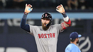 Sep 24, 2024; Toronto, Ontario, CAN;  Boston Red Sox shortstop Trevor Story (10) reacts after hitting an RBI single against the Toronto Blue Jays in the tenth inning at Rogers Centre. 