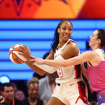 Jul 20, 2024; Phoenix, AZ, USA; USA Women's National Team forward A’ja Wilson (9) against Team WNBA guard Caitlin Clark (22) during the WNBA All Star game at Footprint Center. Mandatory Credit: Mark J. Rebilas-Imagn Images