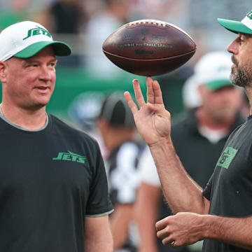 Aaron Rodgers (left) and Jets offensive coordinator Nathaniel Hackett.