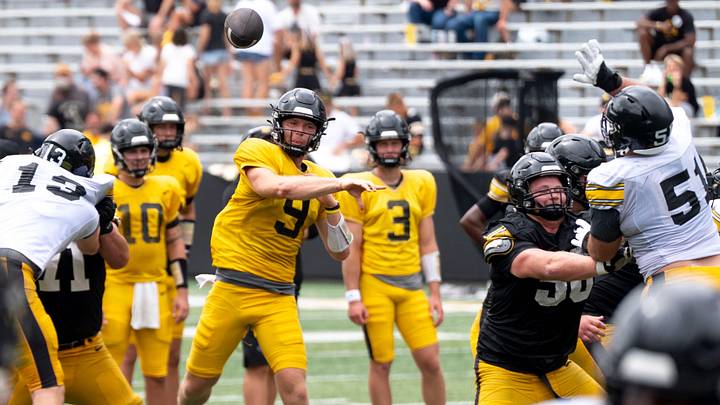 Iowa quarterback Hank Brown (9) passes the football Aug. 15, 2026 during the Kids Day at Kinnick open practice at Kinnick Stadium in Iowa City, Iowa.
