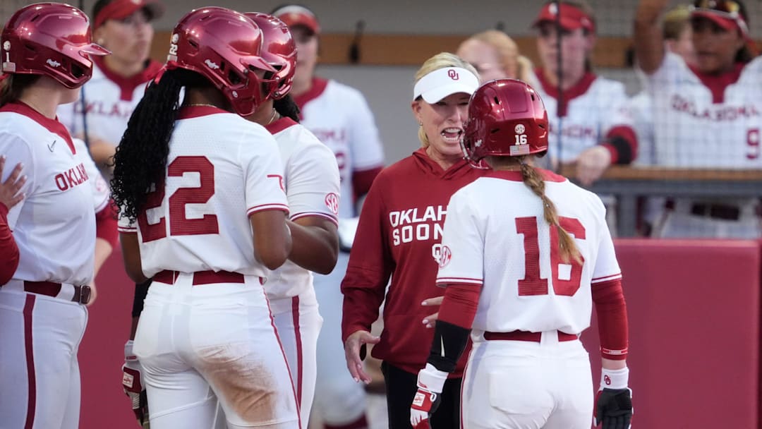Patty Gasso talks with Abby Dayton during a game against Kentucky at Love's Field on April 2 in Norman, Okla.