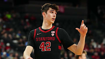 Mar 13, 2024; Las Vegas, NV, USA; Stanford Cardinal forward Maxime Raynaud (42) talks to a team mate on the bench before a California Bears free throw attempt during the first half at T-Mobile Arena. Mandatory Credit: Stephen R. Sylvanie-Imagn Images