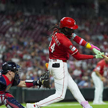Jul 31, 2025; Cincinnati, OH, USA; Cincinnati Reds shortstop Elly De La Cruz (44) hits an RBI single against the Atlanta Braves in the eighth inning at Great American Ball Park. Mandatory Credit: Aaron Doster-Imagn Images