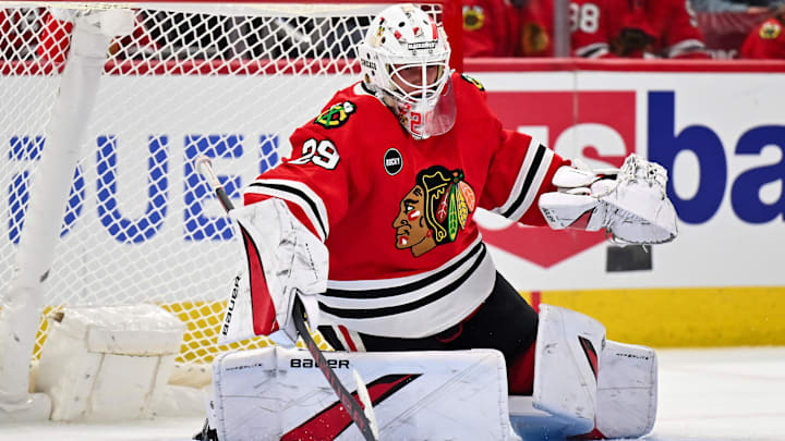 Sep 28, 2023; Chicago, Illinois, USA;  Chicago Blackhawks goaltender Drew Commesso (29) defends the net against the St. Louis Blues at United Center. Mandatory Credit: Jamie Sabau-Imagn Images