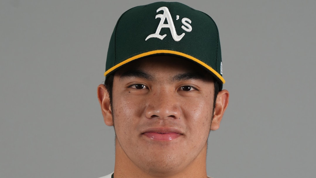 Feb 20, 2026; Mesa, AZ, USA; Athletics pitcher Wei-En Lin (81) poses for Photo Day at HoHoKam Stadium. Mandatory Credit: Rick Scuteri-Imagn Images