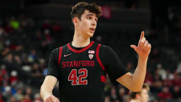 Mar 13, 2024; Las Vegas, NV, USA; Stanford Cardinal forward Maxime Raynaud (42) talks to a team mate on the bench before a California Bears free throw attempt during the first half at T-Mobile Arena. Mandatory Credit: Stephen R. Sylvanie-Imagn Images