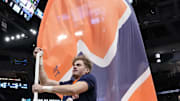 Mar 23, 2025; Milwaukee, WI, USA;  An Illinois Fighting Illini cheerleader performs prior to the game against the Kentucky Wildcats in the second round of the NCAA Tournament at Fiserv Forum. Mandatory Credit: Jeff Hanisch-Imagn Images