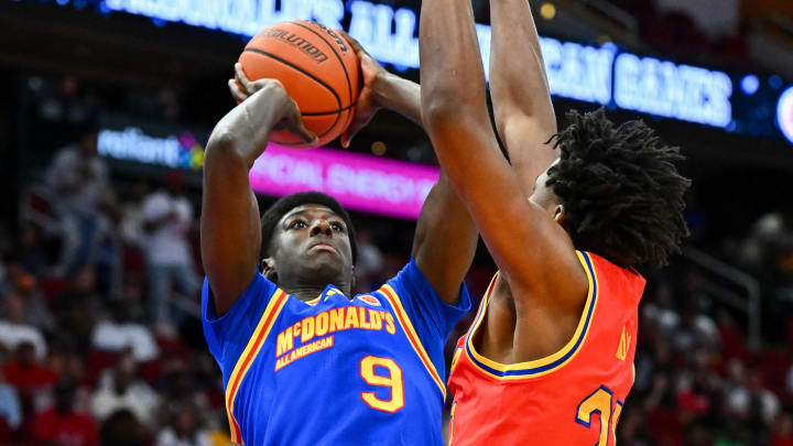 Apr 2, 2024; Houston, TX, USA; McDonald's All American East guard Drake Powell (9) shoots the ball over McDonald's All American West guard Karter Knox (21) during the first half at Toyota Center. Mandatory Credit: Maria Lysaker-USA TODAY Sports