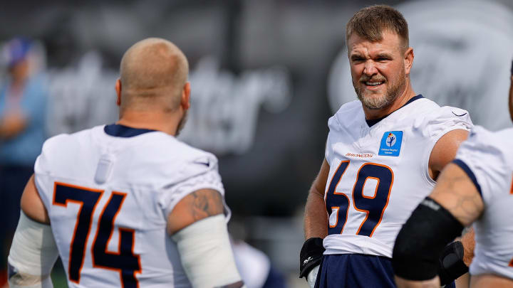 Jul 26, 2024; Englewood, CO, USA; Denver Broncos offensive tackle Mike McGlinchey (69) and guard Ben Powers (74) and guard Quinn Meinerz (77) during training camp at Broncos Park Powered by CommonSpirit. 