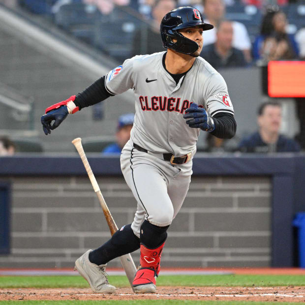 Andres Gimenez swings and hits an RBI single.