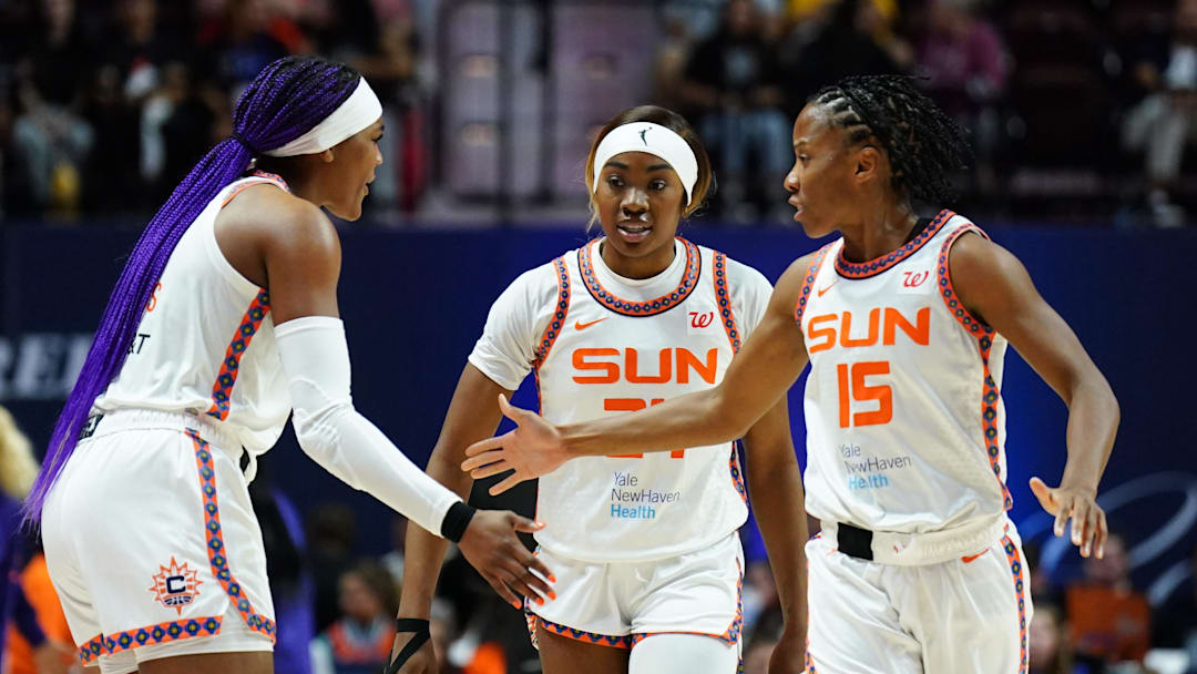 Sep 6, 2025; Uncasville, Connecticut, USA; Connecticut Sun forward Aneesah Morrow (24), forward Aaliyah Edwards (8) and guard Lindsay Allen (15) react after a play against the Phoenix Mercury in the second half at Mohegan Sun Arena. 