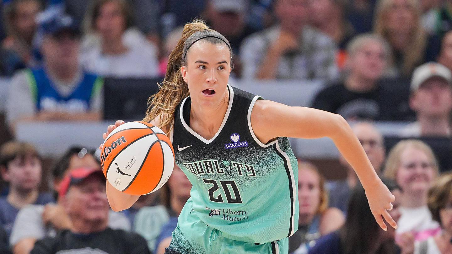 Sabrina Ionescu shooting three-pointer