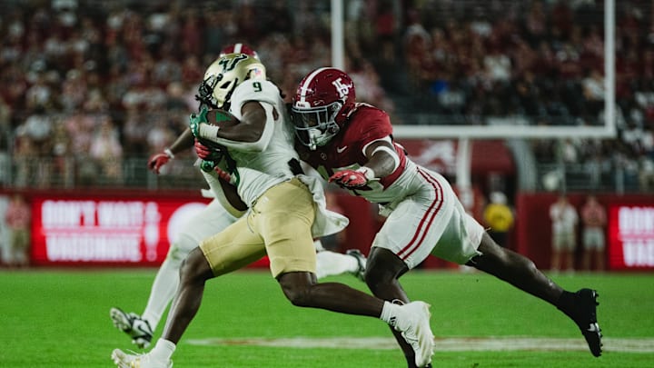 Sep 7, 2024; Tuscaloosa, Alabama, USA;  Alabama Crimson Tide linebacker Justin Jefferson (15) dives for South Florida Bulls running back Ta'Ron Keith (9) as he runs the ball down the field during the fourth quarter at Bryant-Denny Stadium. Mandatory Credit: William McLelland-Imagn Images