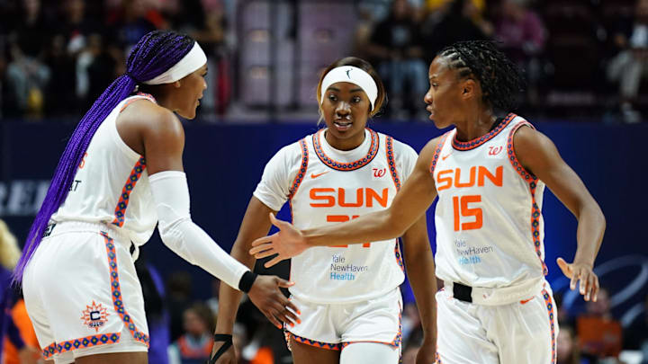 Sep 6, 2025; Uncasville, Connecticut, USA; Connecticut Sun forward Aneesah Morrow (24), forward Aaliyah Edwards (8) and guard Lindsay Allen (15) react after a play against the Phoenix Mercury in the second half at Mohegan Sun Arena. 