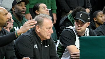 Jan 19, 2025; East Lansing, Michigan, USA;  Tigers Cy Young award winner Tarik Skubal watches Michigan State Spartans head coach Tom Izzo during the first half against the Illinois Fighting Illini at Jack Breslin Student Events Center. Mandatory Credit: Dale Young-Imagn Images