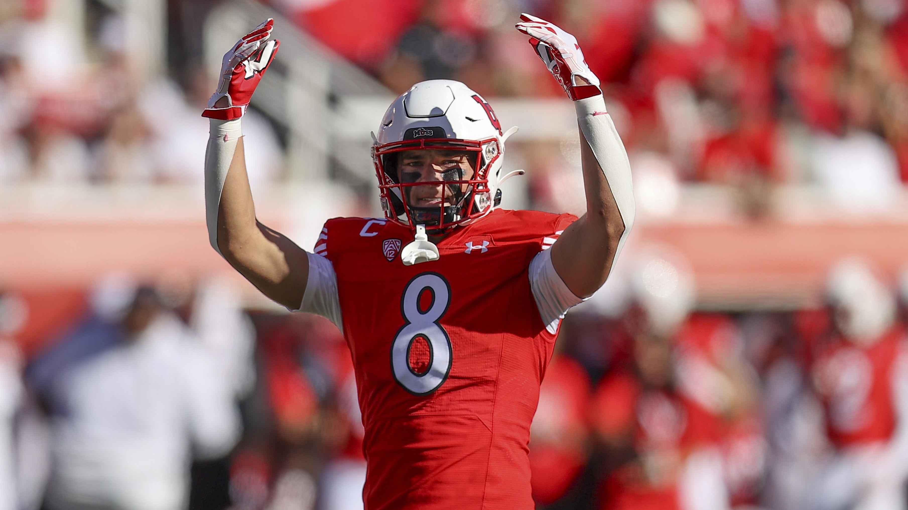 Utah Utes safety Cole Bishop (8) encourages the fans.