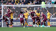 Manchester City snatched three points in the final minute of additional time at Molineux