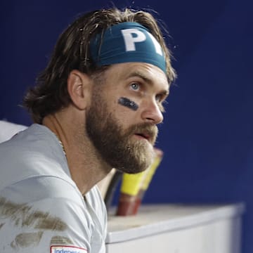 Sep 8, 2024; Miami, Florida, USA;  Philadelphia Phillies first baseman Bryce Harper (3) sits in the dugout against the Miami Marlins in the second inning at loanDepot Park.