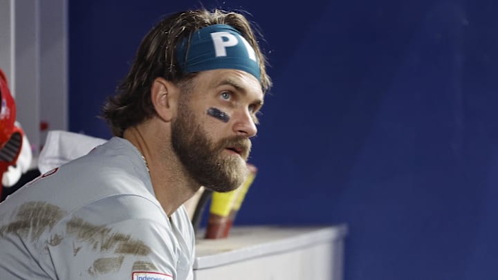 Sep 8, 2024; Miami, Florida, USA;  Philadelphia Phillies first baseman Bryce Harper (3) sits in the dugout against the Miami Marlins in the second inning at loanDepot Park.