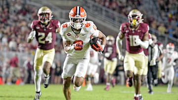 Oct 5, 2024; Tallahassee, Florida, USA; Clemson Tigers wide receiver Antonio Williams (0) scores a touchdown against the Florida State Seminoles during the first half at Doak S. Campbell Stadium. Mandatory Credit: Melina Myers-Imagn Images