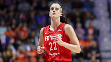 Sep 25, 2024; Uncasville, Connecticut, USA; Indiana Fever guard Caitlin Clark (22) reacts during the first half against the Connecticut Sun during game two of the first round of the 2024 WNBA Playoffs at Mohegan Sun Arena. Mandatory Credit: Paul Rutherford-Imagn Images