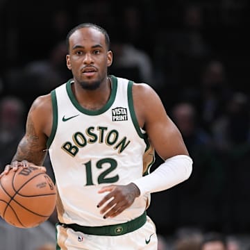 Apr 7, 2024; Boston, Massachusetts, USA; Boston Celtics forward Oshae Brissett (12) moves the ball against the Portland Trail Blazers during the second half at TD Garden. Mandatory Credit: Eric Canha-Imagn Images